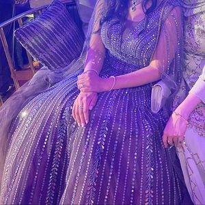 Purple grayish gown with glasswork and silver embellishments.